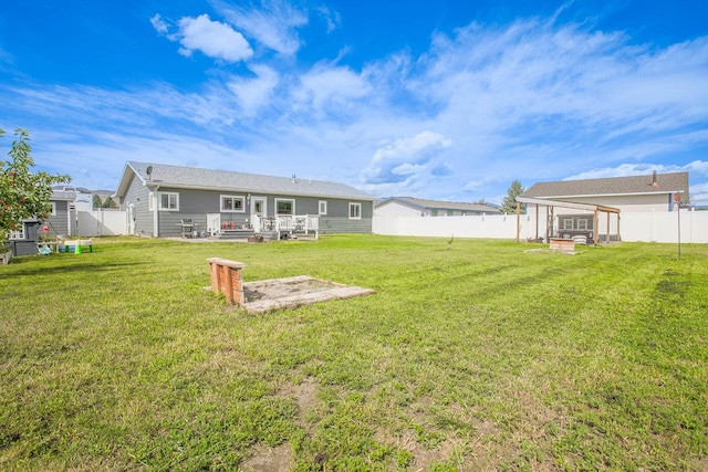205 Kolczak Ln, Townsend, MT 59644 - rear view of property featuring a wooden deck and a fenced backyard