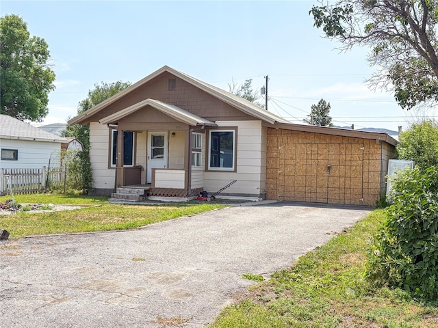513 N Spruce St, Townsend, MT 59644 - view of front of house with asphalt driveway and covered porch