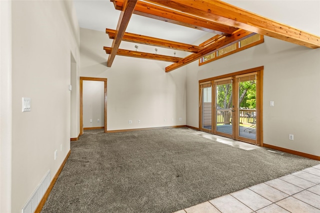 103 Crescent Lndg, Polson, MT 59860 - unfurnished living room featuring light carpet, beamed ceiling, high vaulted ceiling, and light tile patterned floors