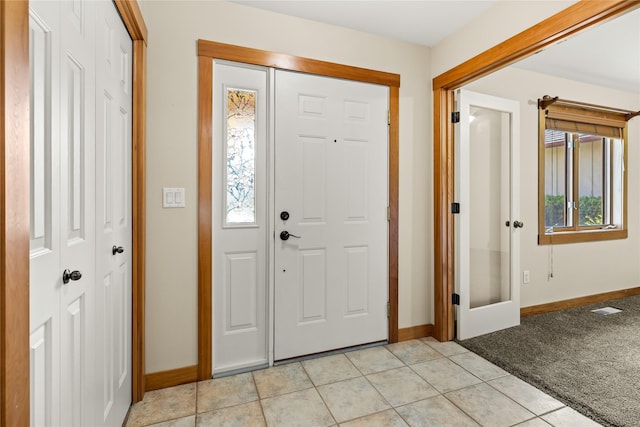 103 Crescent Lndg, Polson, MT 59860 - entryway featuring light tile patterned floors and light colored carpet