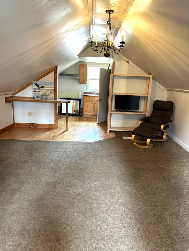 645 Morrell Creek Dr, Seeley Lake, MT 59868 - bonus room featuring carpet, lofted ceiling, and a chandelier