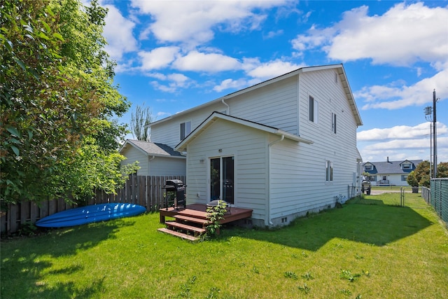1483 Western Dr, Kalispell, MT 59901 - back of property featuring a wooden deck and a fenced backyard