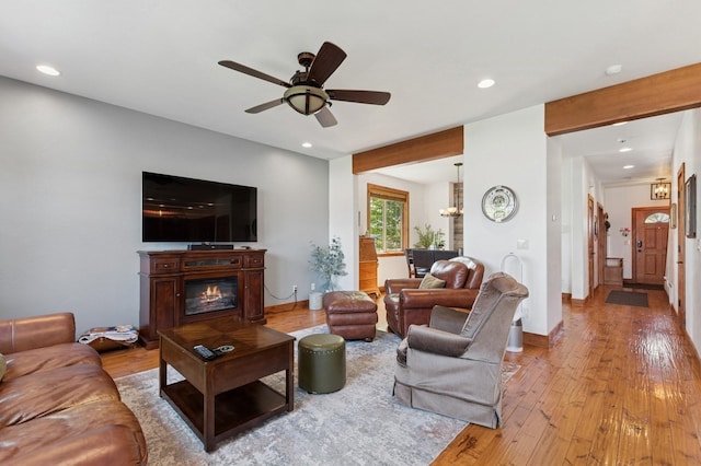 101 Heavens Peak Dr, Kalispell, MT 59901 - living room featuring recessed lighting, a ceiling fan, light wood-style floors, and a glass covered fireplace