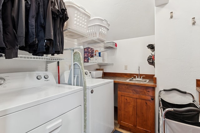 101 Heavens Peak Dr, Kalispell, MT 59901 - washroom with washing machine and clothes dryer and cabinet space
