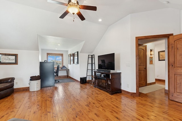 101 Heavens Peak Dr, Kalispell, MT 59901 - living area with light wood finished floors, vaulted ceiling, a desk, and a ceiling fan