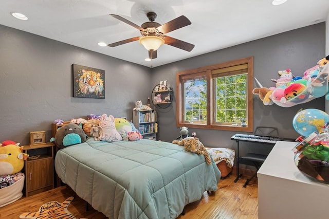 101 Heavens Peak Dr, Kalispell, MT 59901 - bedroom featuring wood finished floors, recessed lighting, and ceiling fan