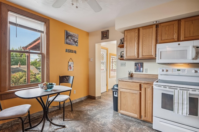 1046 W Park St, Butte, MT 59701 - kitchen with white appliances, ceiling fan, stone finish floors, and open shelves