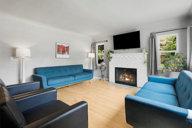 546 Woodworth Ave, Missoula, MT 59801 - living area with a brick fireplace and wood finished floors