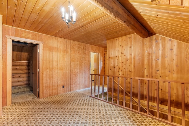 581 Timber Trl, Stevensville, MT 59870 - hallway featuring wood ceiling, wood walls, carpet floors, an upstairs landing, and a chandelier