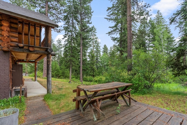 581 Timber Trl, Stevensville, MT 59870 - wooden terrace featuring outdoor dining space and a patio area