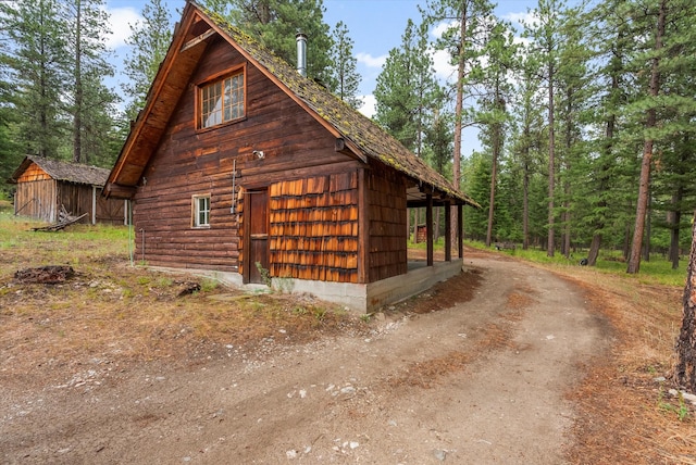 581 Timber Trl, Stevensville, MT 59870 - view of property exterior with an outdoor structure