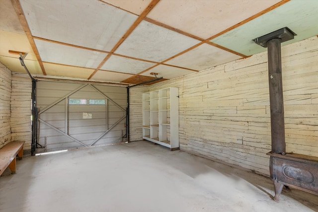 581 Timber Trl, Stevensville, MT 59870 - garage featuring a wood stove