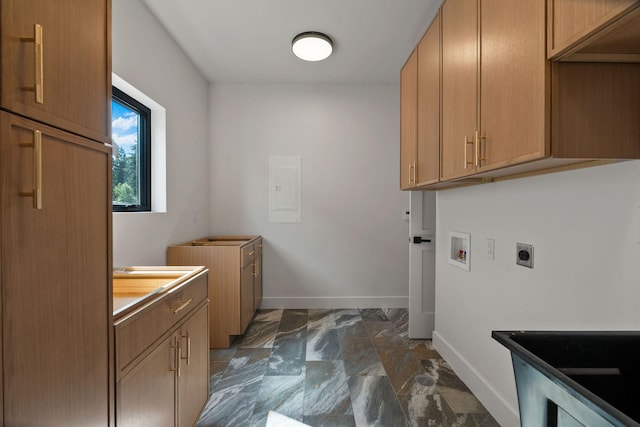 211 Whisper Ridge Dr, Bigfork, MT 59911 - laundry room featuring hookup for an electric dryer, electric panel, cabinet space, washer hookup, and dark marble finish floors