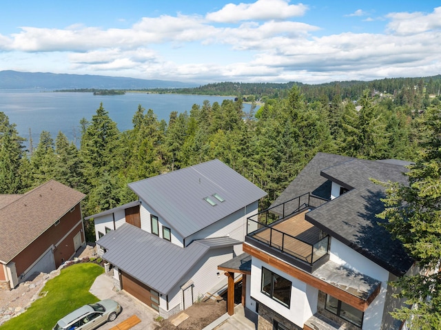 211 Whisper Ridge Dr, Bigfork, MT 59911 - aerial view of property and surrounding area featuring a heavily wooded area and a nearby body of water