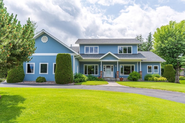 286 Arbour Dr W, Kalispell, MT 59901 - view of front of home with a front lawn, covered porch, and a shingled roof