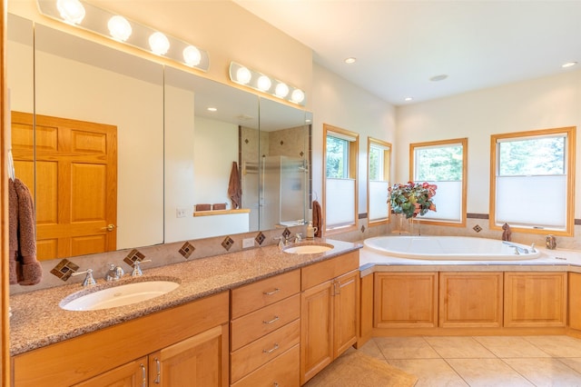 286 Arbour Dr W, Kalispell, MT 59901 - bathroom featuring a shower stall, double vanity, a bath, tile patterned floors, and recessed lighting