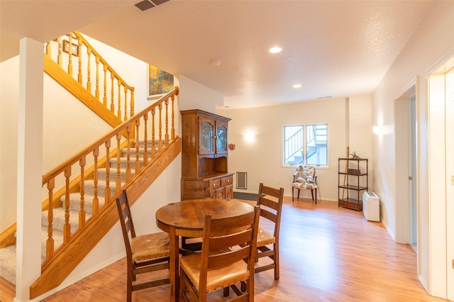 286 Arbour Dr W, Kalispell, MT 59901 - dining room featuring light wood-style floors, stairs, and recessed lighting