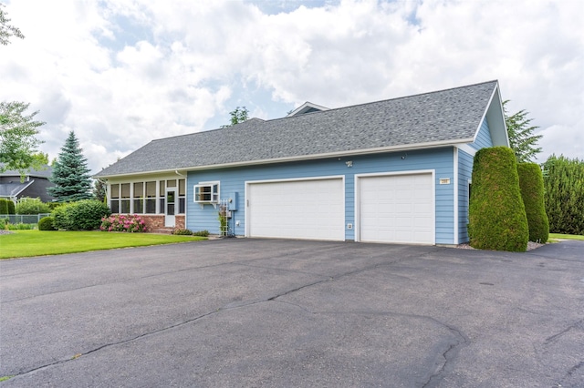 286 Arbour Dr W, Kalispell, MT 59901 - view of front of property featuring driveway, a garage, and a shingled roof