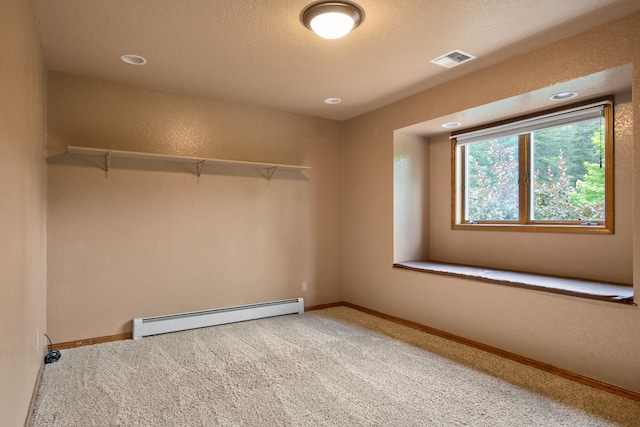 9995 Obrien Creek Rd, Missoula, MT 59804 - carpeted empty room featuring baseboard heating and recessed lighting