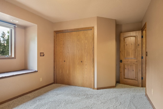 9995 Obrien Creek Rd, Missoula, MT 59804 - unfurnished bedroom featuring a closet and carpet floors