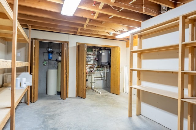 9995 Obrien Creek Rd, Missoula, MT 59804 - unfinished basement with water heater and a water softener system