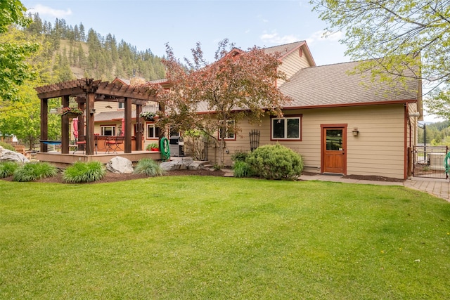 9995 Obrien Creek Rd, Missoula, MT 59804 - rear view of house with a pergola, a deck, and a shingled roof