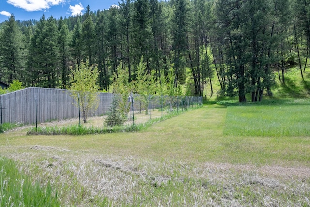 9995 Obrien Creek Rd, Missoula, MT 59804 - view of yard with an outbuilding, a pole building, and a forest view