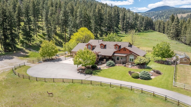 9995 Obrien Creek Rd, Missoula, MT 59804 - view of rural area featuring a forest and a mountainous background