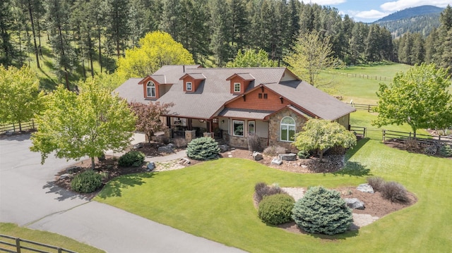 9995 Obrien Creek Rd, Missoula, MT 59804 - view of front of home with stone siding and a wooded view