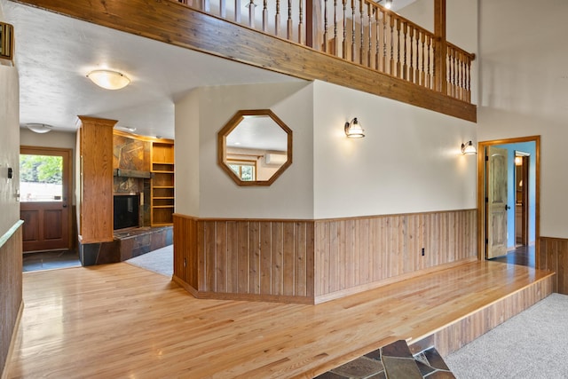 9995 Obrien Creek Rd, Missoula, MT 59804 - hallway featuring wooden walls, wainscoting, and wood finished floors