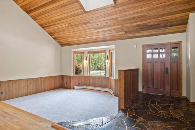 9995 Obrien Creek Rd, Missoula, MT 59804 - entryway with a baseboard radiator, wood ceiling, wainscoting, vaulted ceiling, and wooden walls