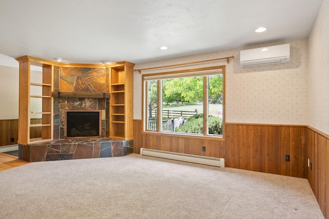 9995 Obrien Creek Rd, Missoula, MT 59804 - unfurnished living room featuring baseboard heating, a wall mounted AC, a wainscoted wall, wooden walls, and a stone fireplace