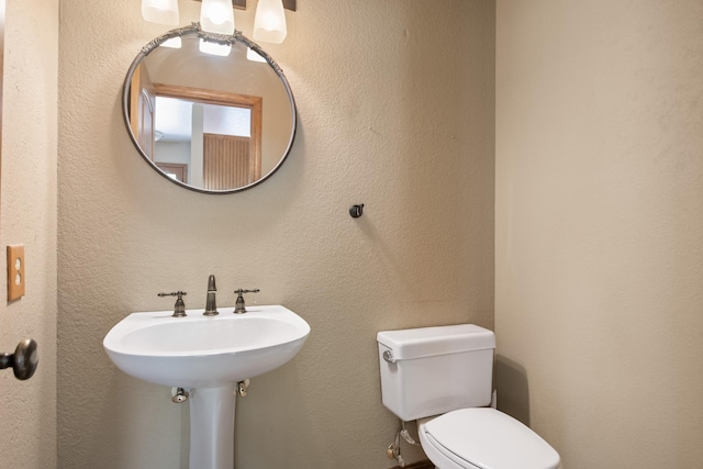 9995 Obrien Creek Rd, Missoula, MT 59804 - half bath featuring toilet and a textured wall