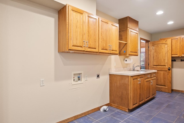 9995 Obrien Creek Rd, Missoula, MT 59804 - laundry area featuring electric dryer hookup, washer hookup, cabinet space, dark tile patterned flooring, and recessed lighting