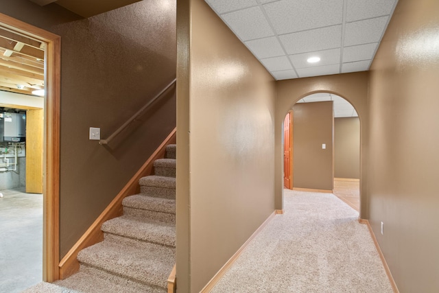 9995 Obrien Creek Rd, Missoula, MT 59804 - stairway with arched walkways, carpet, and a paneled ceiling