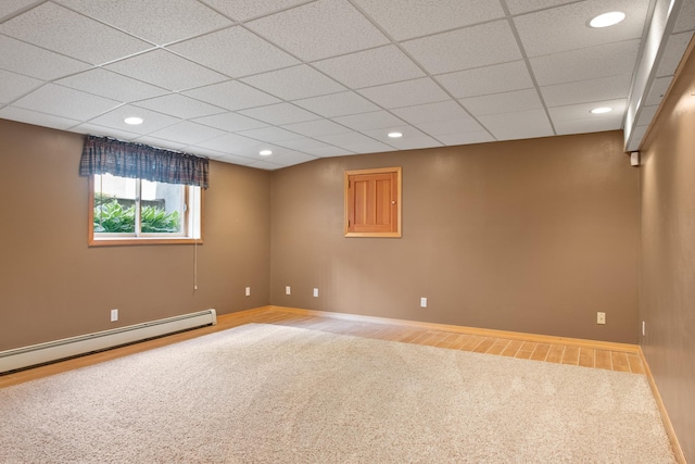 9995 Obrien Creek Rd, Missoula, MT 59804 - empty room featuring carpet, a baseboard heating unit, a paneled ceiling, and recessed lighting