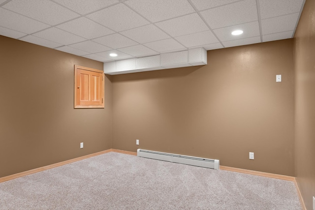9995 Obrien Creek Rd, Missoula, MT 59804 - finished below grade area with a baseboard radiator, a paneled ceiling, carpet flooring, and recessed lighting