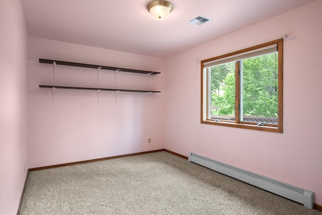 9995 Obrien Creek Rd, Missoula, MT 59804 - carpeted spare room featuring a baseboard heating unit and baseboards