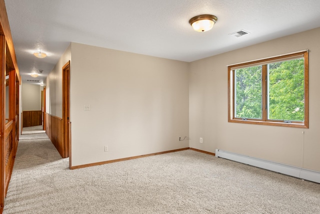 9995 Obrien Creek Rd, Missoula, MT 59804 - spare room featuring light carpet and baseboard heating