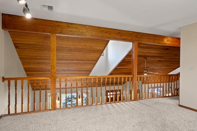 9995 Obrien Creek Rd, Missoula, MT 59804 - corridor featuring carpet flooring, lofted ceiling, healthy amount of natural light, wooden ceiling, and rail lighting