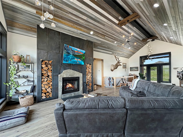 8 Montana Way, Ennis, MT 59729 - living room with wood finished floors, recessed lighting, a tile fireplace, and wooden ceiling
