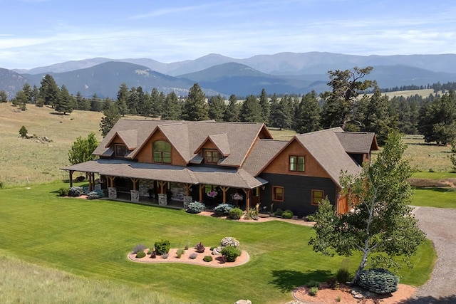 3 Antelope Ct, Clancy, MT 59634 - view of front of house with a mountain view, a front yard, and covered porch