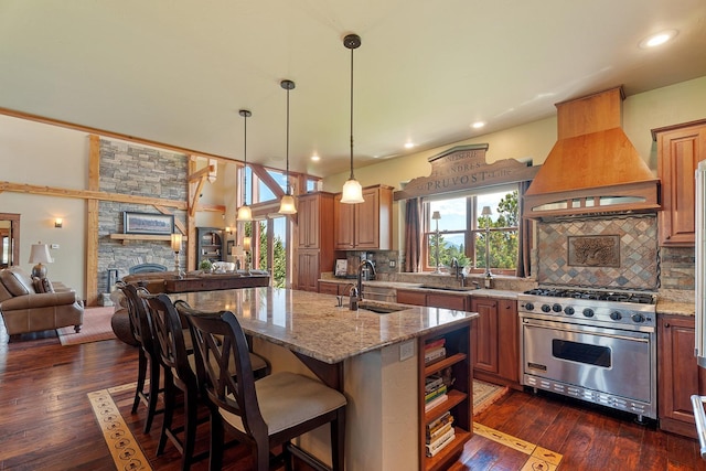 3 Antelope Ct, Clancy, MT 59634 - kitchen featuring designer stove, premium range hood, open floor plan, light stone counters, and recessed lighting