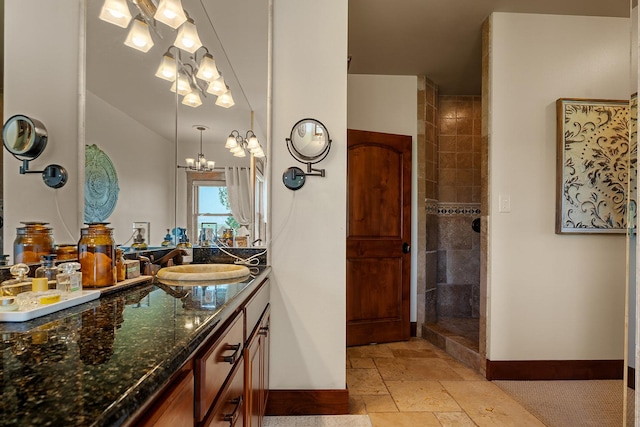 3 Antelope Ct, Clancy, MT 59634 - bathroom with vanity, stone tile flooring, a tile shower, and a chandelier