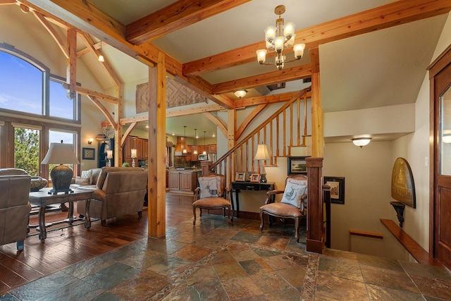 3 Antelope Ct, Clancy, MT 59634 - living area with a chandelier, stone tile floors, beam ceiling, stairs, and high vaulted ceiling