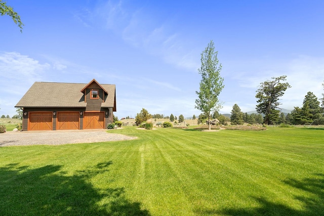3 Antelope Ct, Clancy, MT 59634 - view of green lawn with a barn, an outdoor structure, and a garage