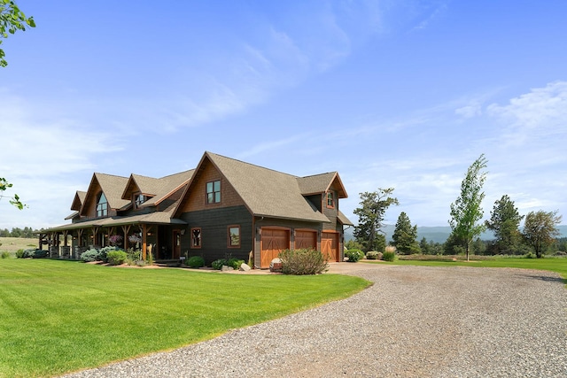 3 Antelope Ct, Clancy, MT 59634 - view of front of property featuring driveway, a front lawn, a shingled roof, and covered porch