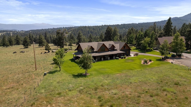3 Antelope Ct, Clancy, MT 59634 - aerial view of property and surrounding area with a heavily wooded area and a mountain backdrop