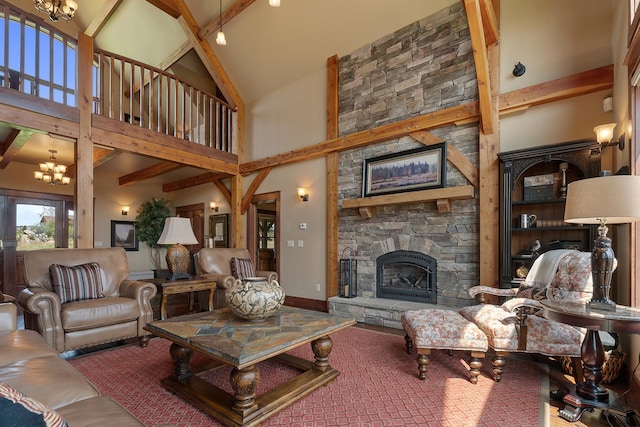 3 Antelope Ct, Clancy, MT 59634 - living area with high vaulted ceiling, a fireplace, beamed ceiling, and a chandelier