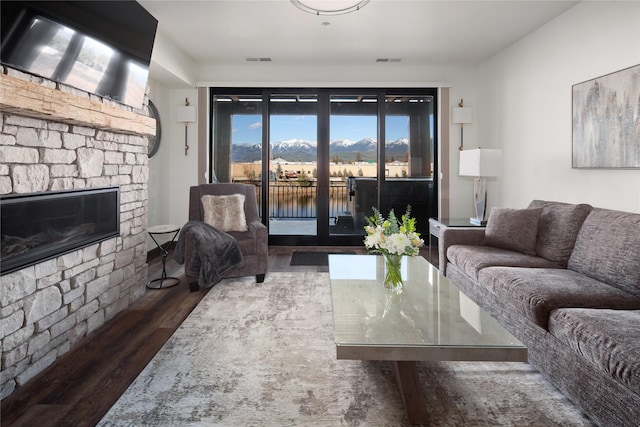 311E Akers Ln Unit E, Whitefish, MT 59937 - living room with a stone fireplace and wood finished floors